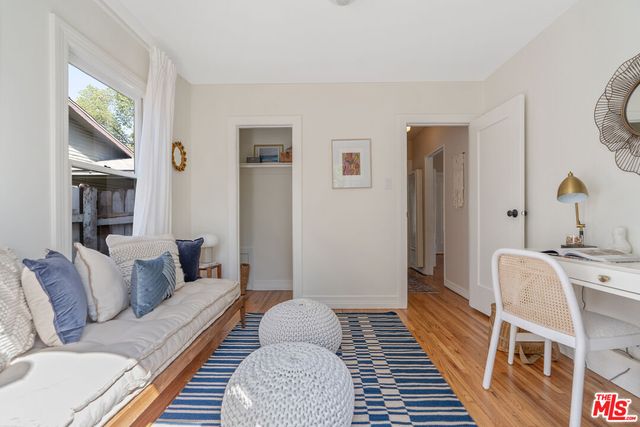 a backyard of a house with outdoor seating