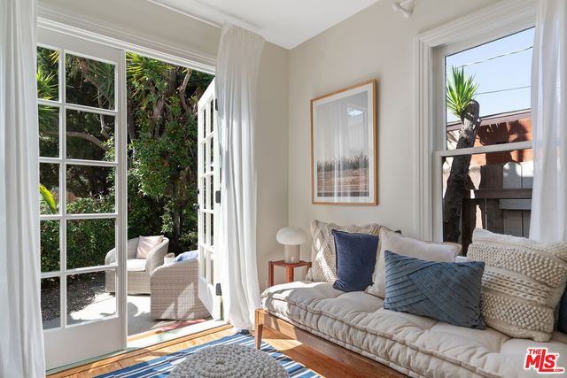a porch with a table and chairs