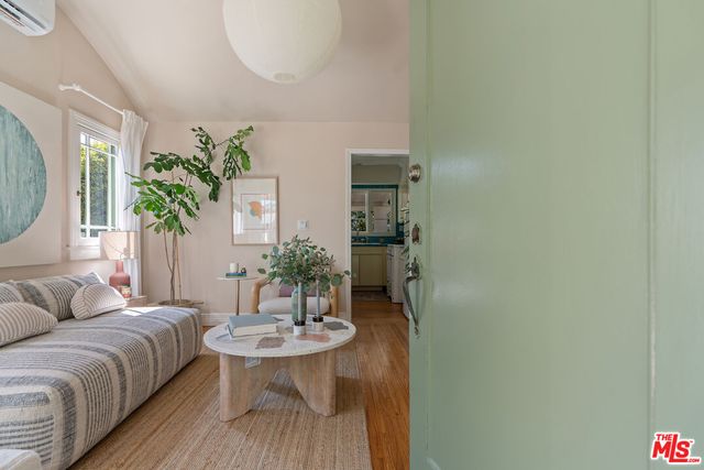 a living room with furniture and a table