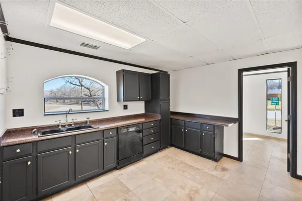 a large bathroom with double vanity and a large mirror