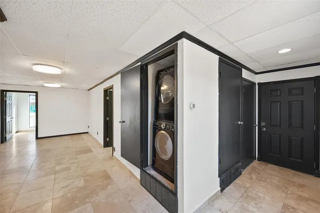 a view of a hallway with closet and entryway