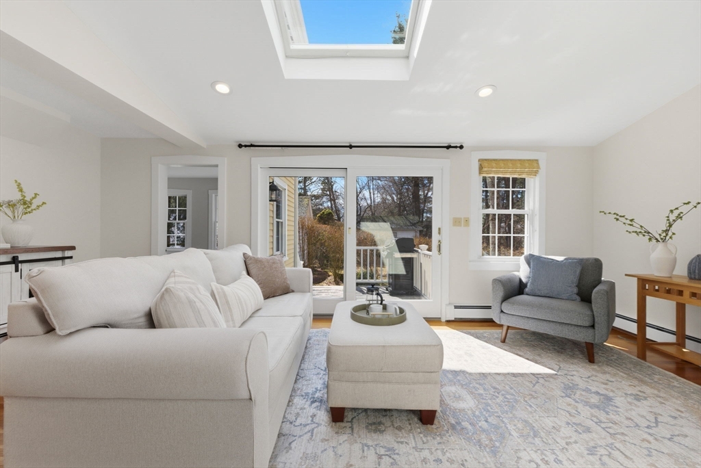 31 Fuller Road Lexington, MA 02420 - Photo 14 of 42 a living room with furniture and a large window