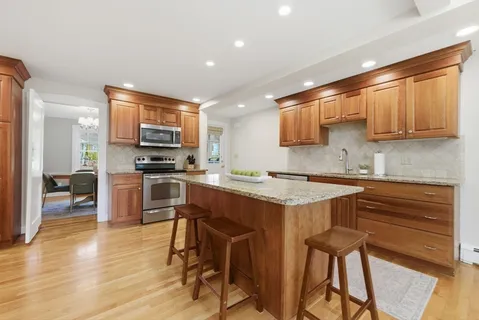 a kitchen with stainless steel appliances a stove a sink dishwasher and a refrigerator