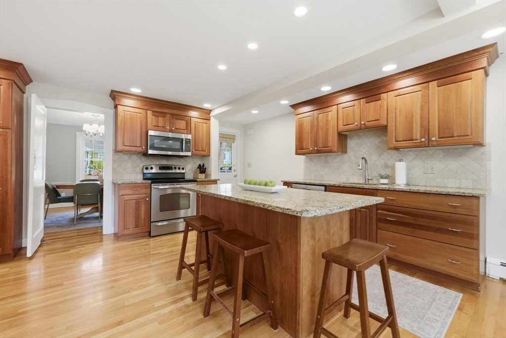 31 Fuller Road Lexington, MA 02420 - Photo 17 of 42 a kitchen with stainless steel appliances a stove a sink dishwasher and a refrigerator