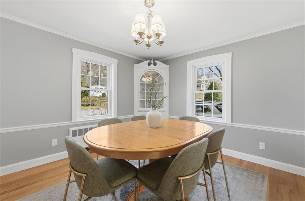 31 Fuller Road Lexington, MA 02420 - Photo 18 of 42 a dining room with furniture a rug and a chandelier