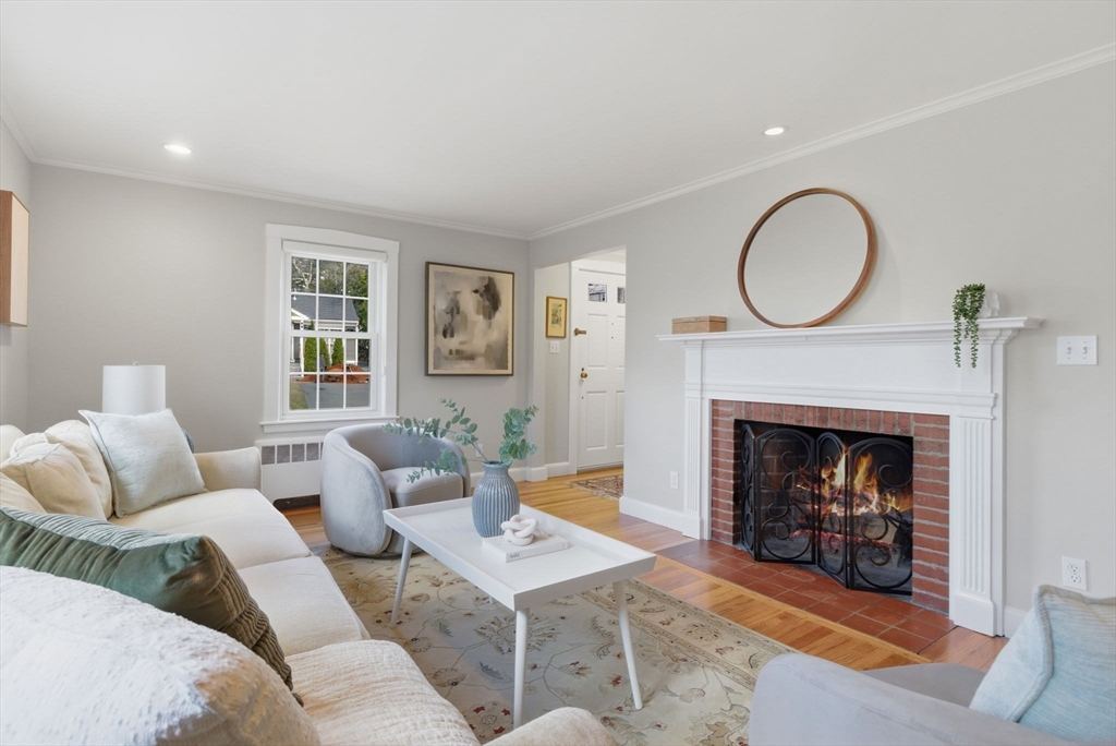 31 Fuller Road Lexington, MA 02420 - Photo 2 of 42 a living room with furniture a window and a fireplace