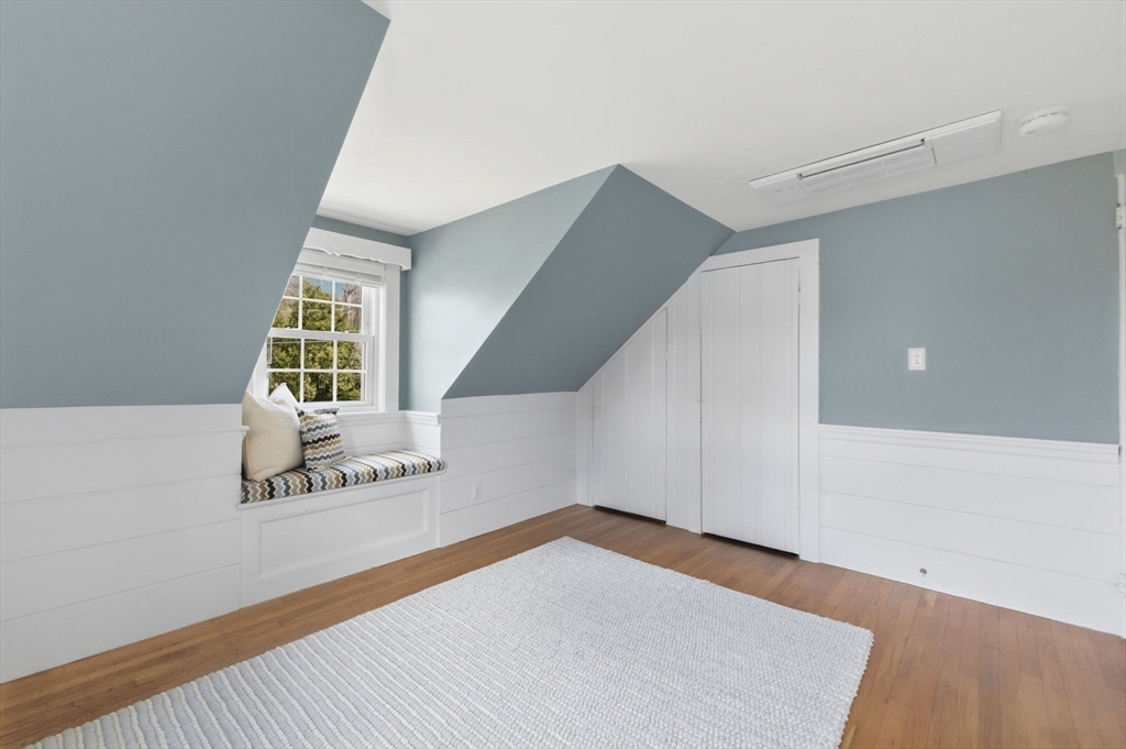 31 Fuller Road Lexington, MA 02420 - Photo 28 of 42 a view of an empty room with wooden floor and stairs