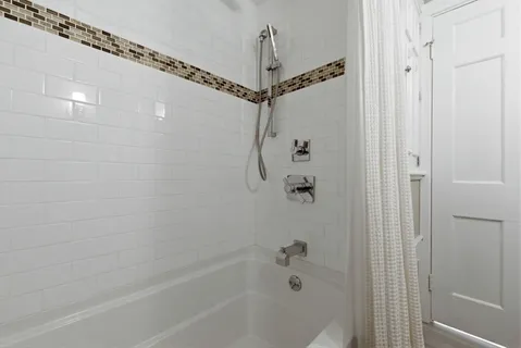 a bathroom with a shower and a shower