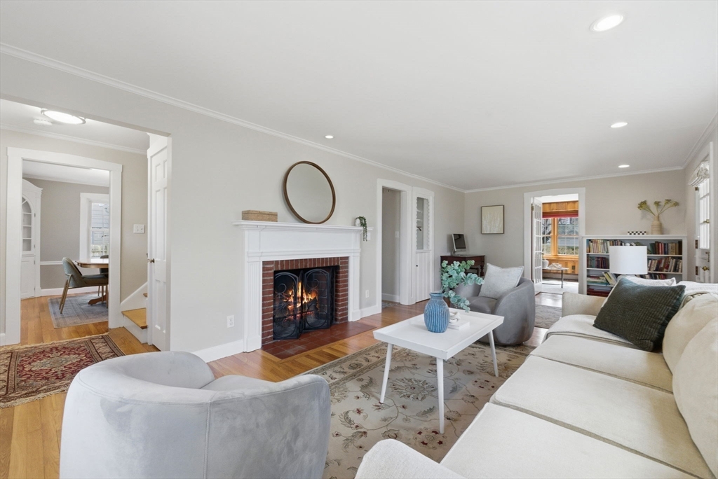 31 Fuller Road Lexington, MA 02420 - Photo 3 of 42 a living room with furniture and a fireplace