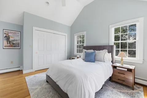 a bedroom with bed and a window