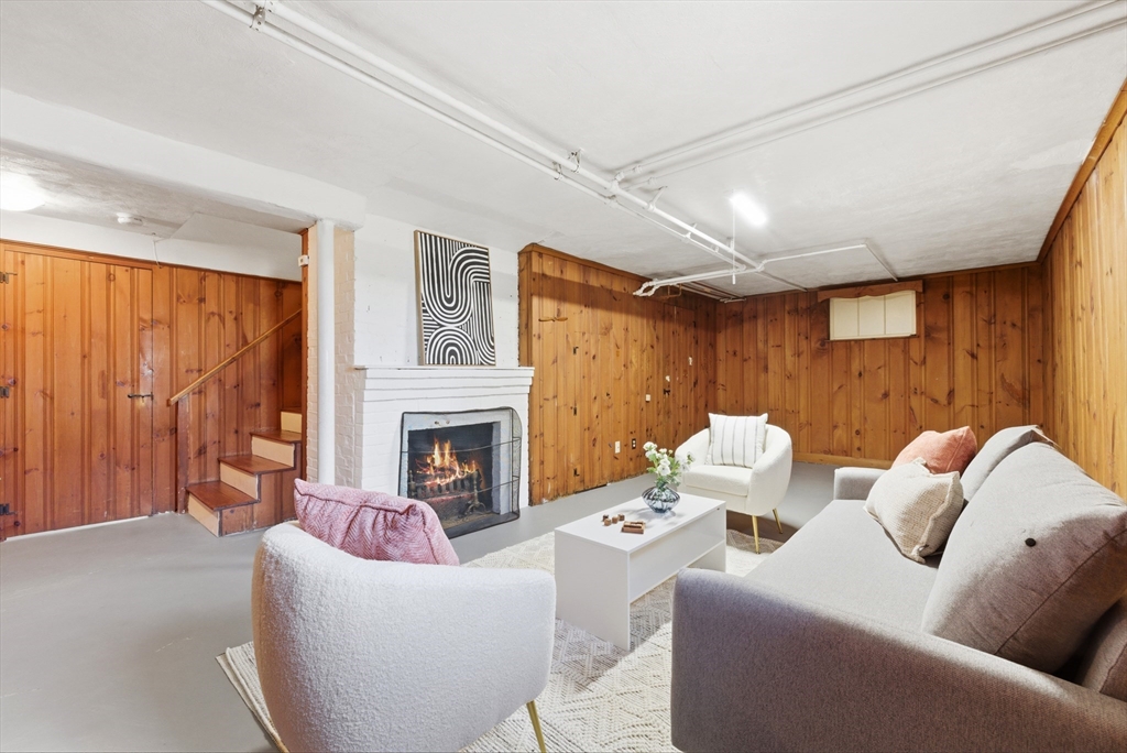 31 Fuller Road Lexington, MA 02420 - Photo 37 of 42 a living room with furniture and a fireplace