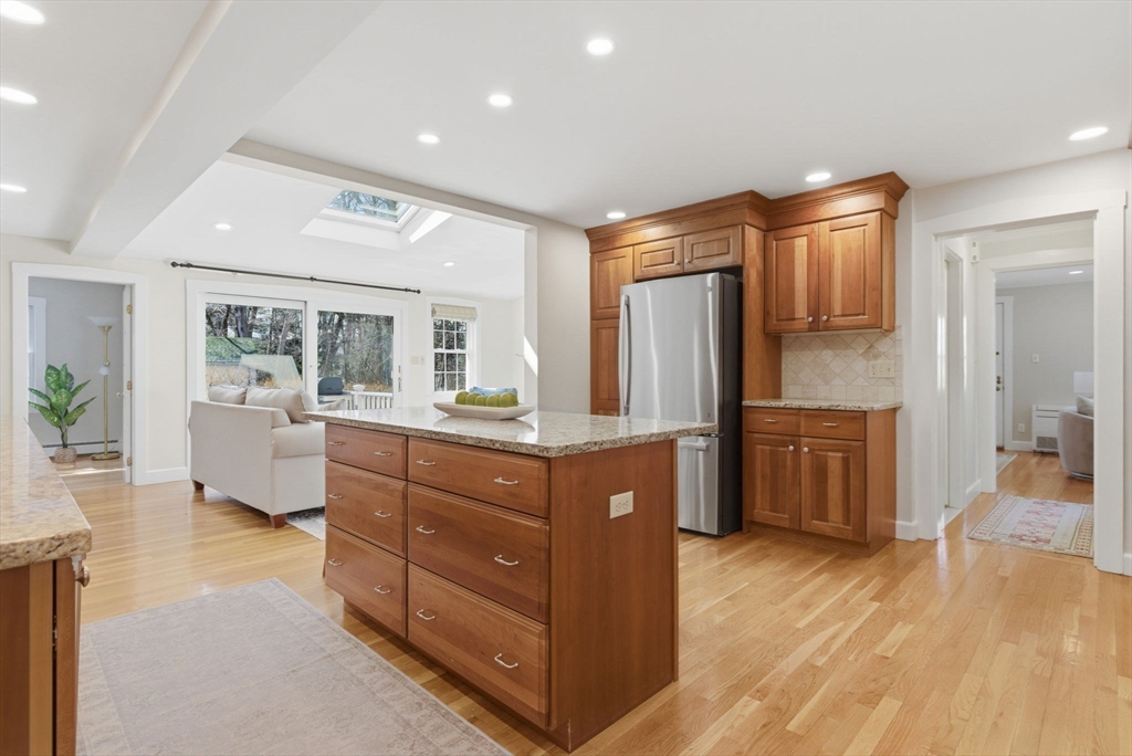 31 Fuller Road Lexington, MA 02420 - Photo 9 of 42 a kitchen with sink cabinets and wooden floor