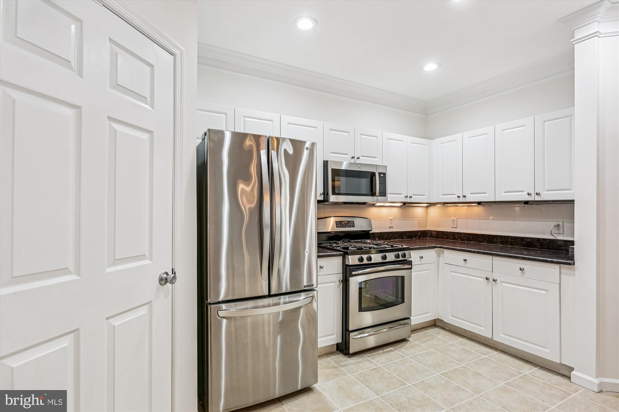 23 Arch Place, Unit 273 Gaithersburg, MD 20878 - Photo 18 of 103 a kitchen with stainless steel appliances granite countertop a refrigerator sink and white cabinets