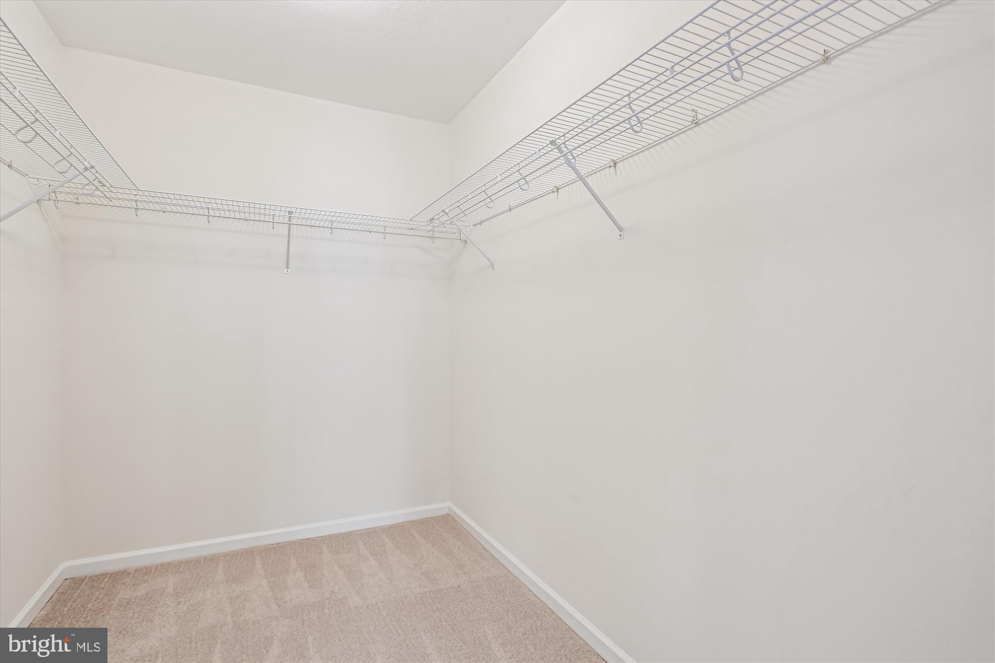 23 Arch Place, Unit 273 Gaithersburg, MD 20878 - Photo 35 of 103 a view of a room with racks on the wall