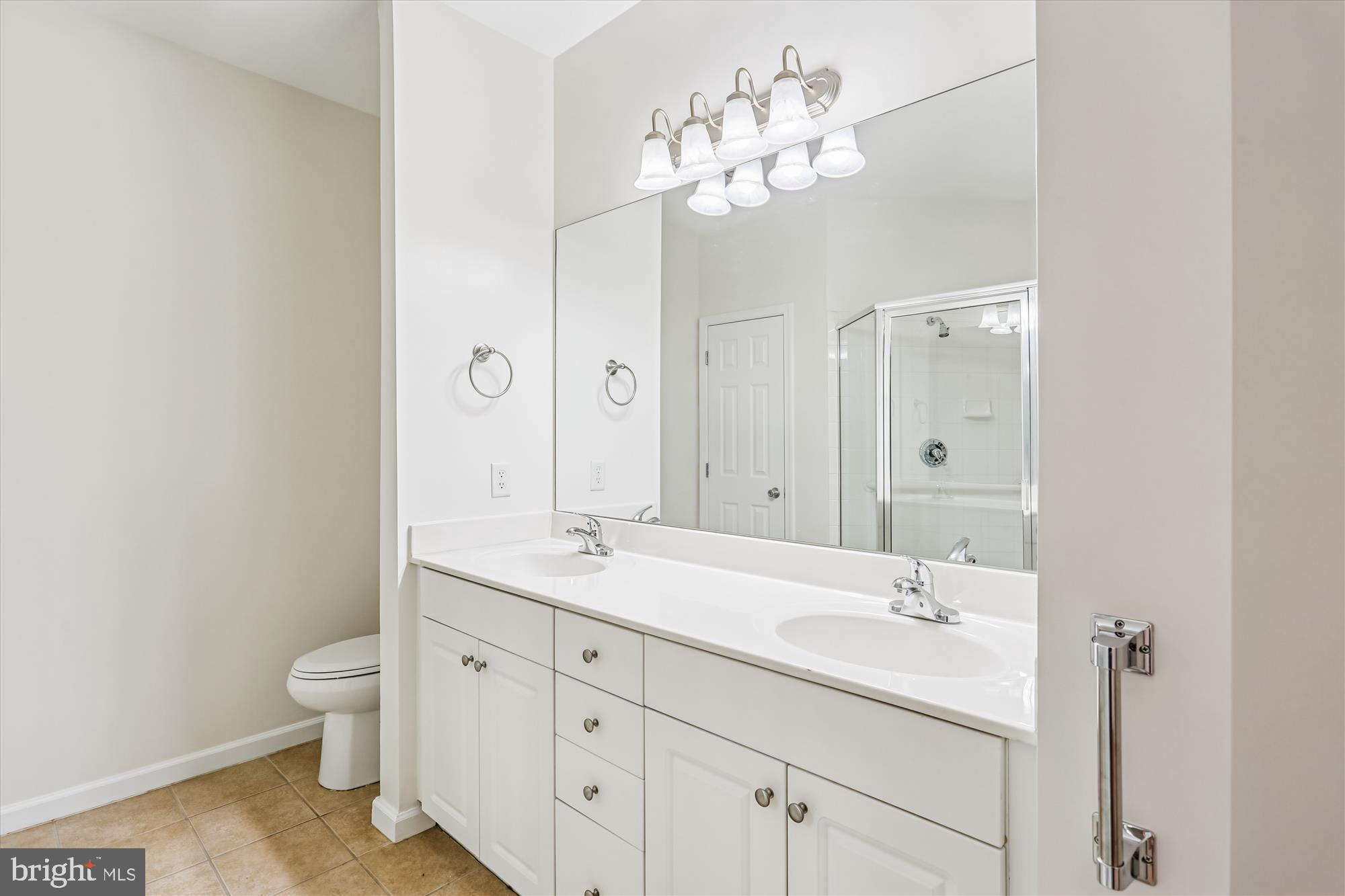 23 Arch Place, Unit 273 Gaithersburg, MD 20878 - Photo 37 of 103 a bathroom with a granite countertop sink a toilet and a mirror