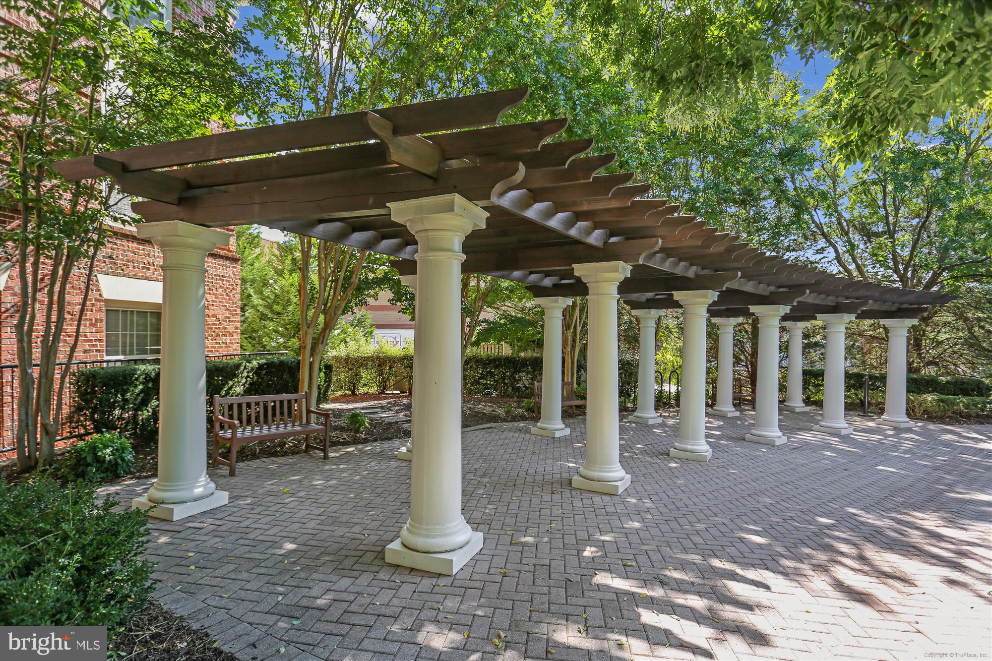 23 Arch Place, Unit 273 Gaithersburg, MD 20878 - Photo 58 of 103 a view of a patio with table and chairs under an umbrella
