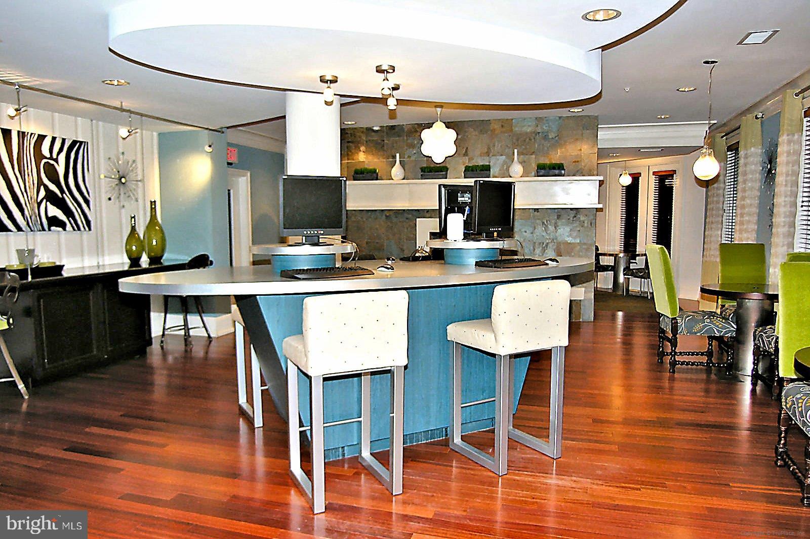 23 Arch Place, Unit 273 Gaithersburg, MD 20878 - Photo 61 of 103 a kitchen with stainless steel appliances kitchen island granite countertop a table chairs sink and cabinets
