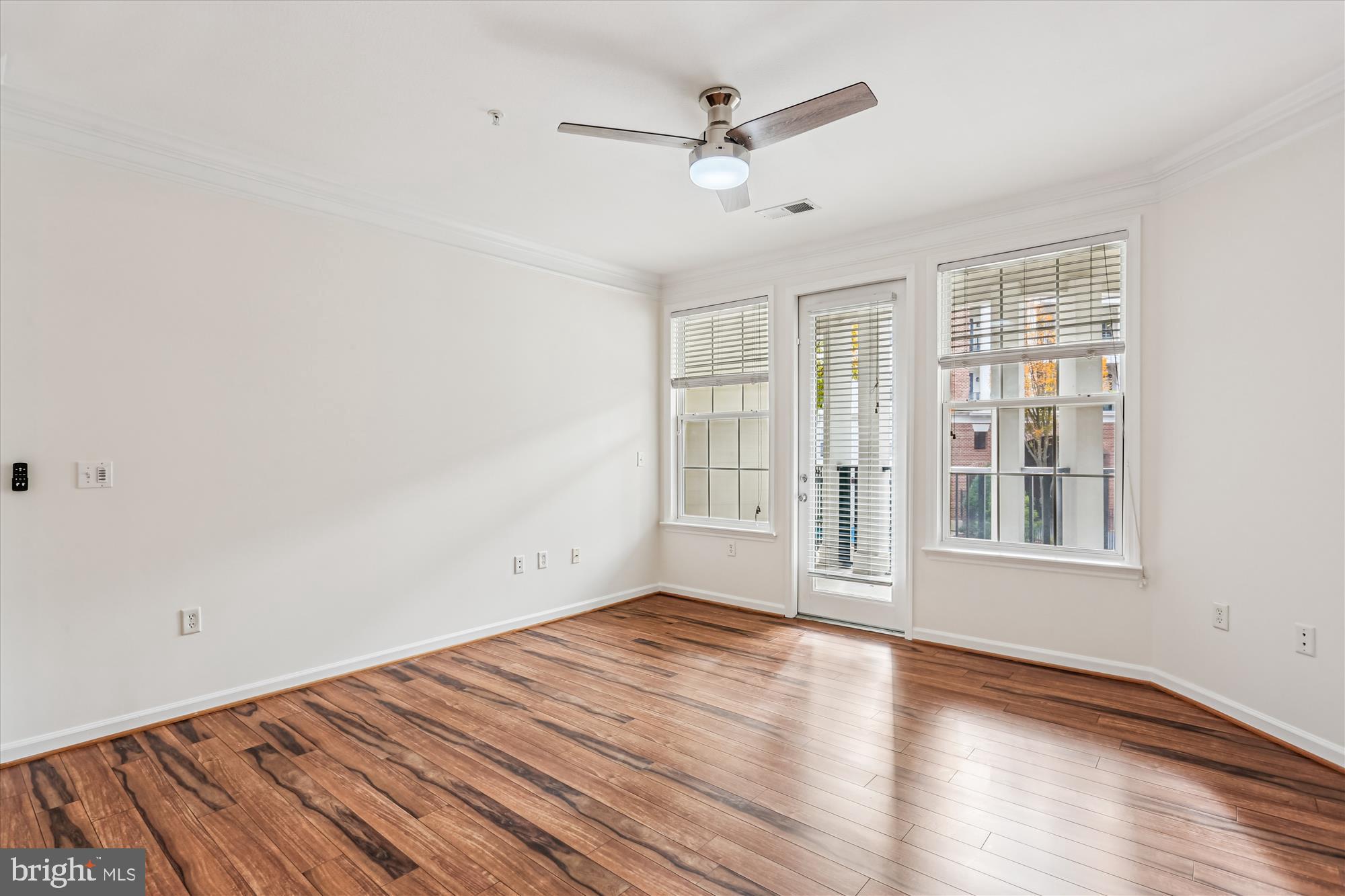 23 Arch Place, Unit 273 Gaithersburg, MD 20878 - Photo 7 of 103 wooden floor in an empty room with a window