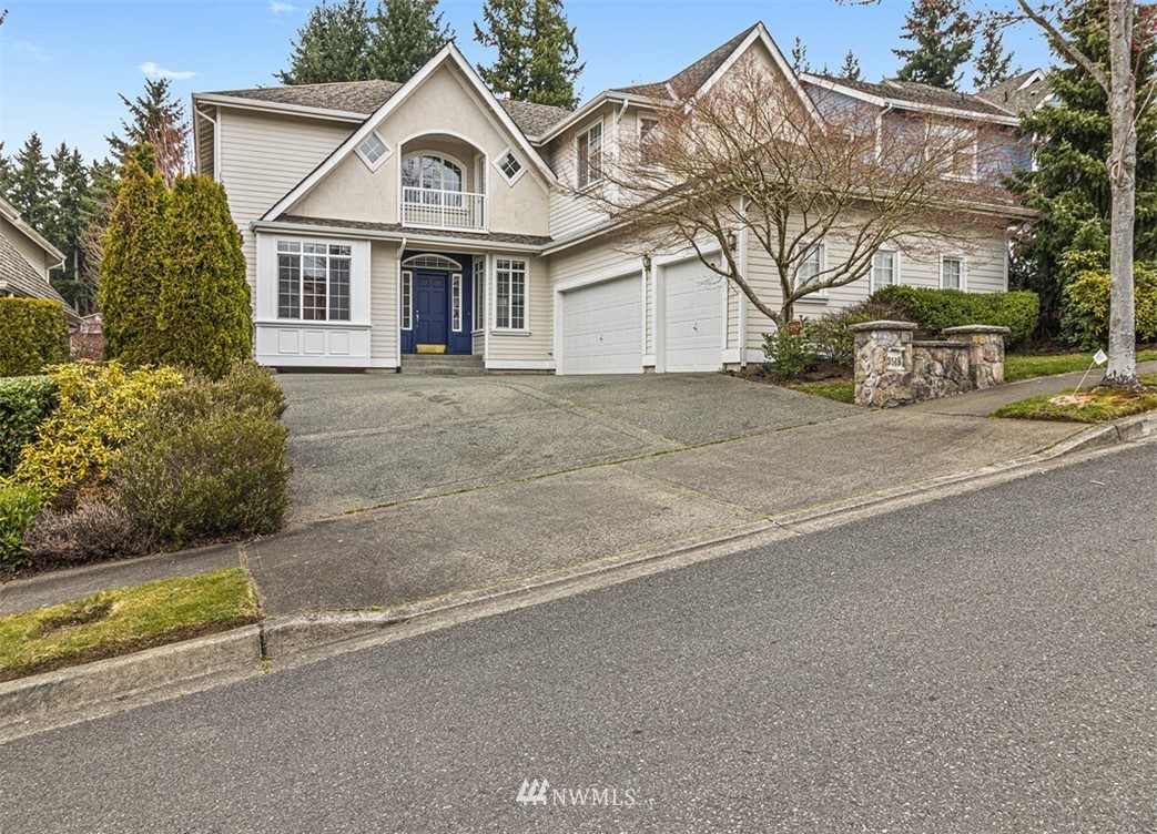 3518 Northeast 24th Court Renton, WA 98056 - Photo 1 of 17 a view of a white house with large windows and a small yard