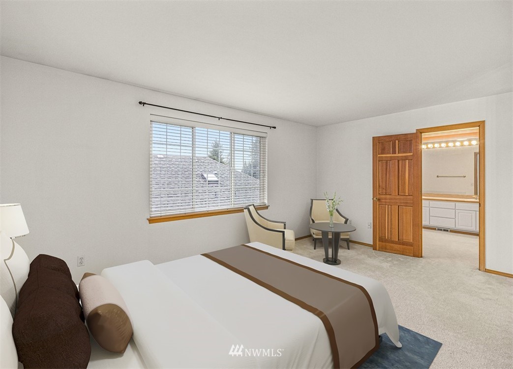 3518 Northeast 24th Court Renton, WA 98056 - Photo 13 of 17 a bedroom with a bed and wooden floor