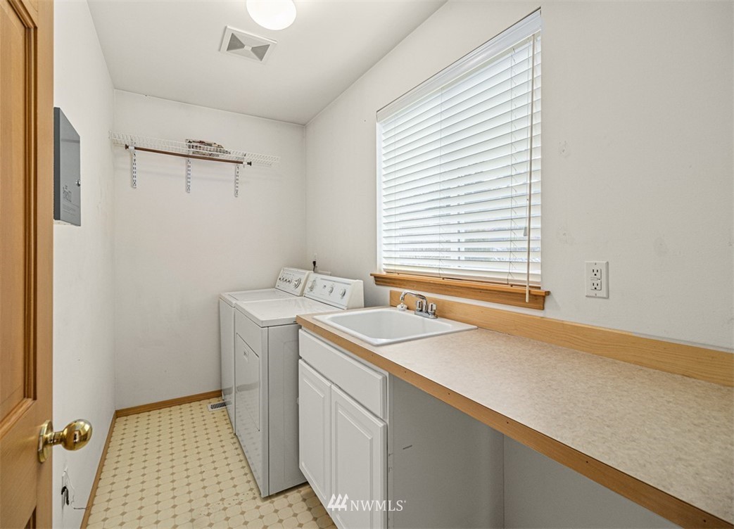 3518 Northeast 24th Court Renton, WA 98056 - Photo 15 of 17 a utility room with a sink dryer and washer