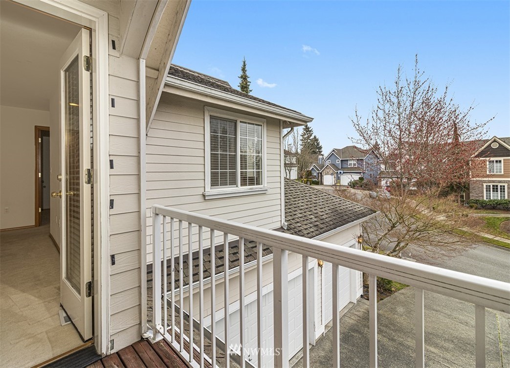 3518 Northeast 24th Court Renton, WA 98056 - Photo 17 of 17 a view of a balcony with wooden floor and fence