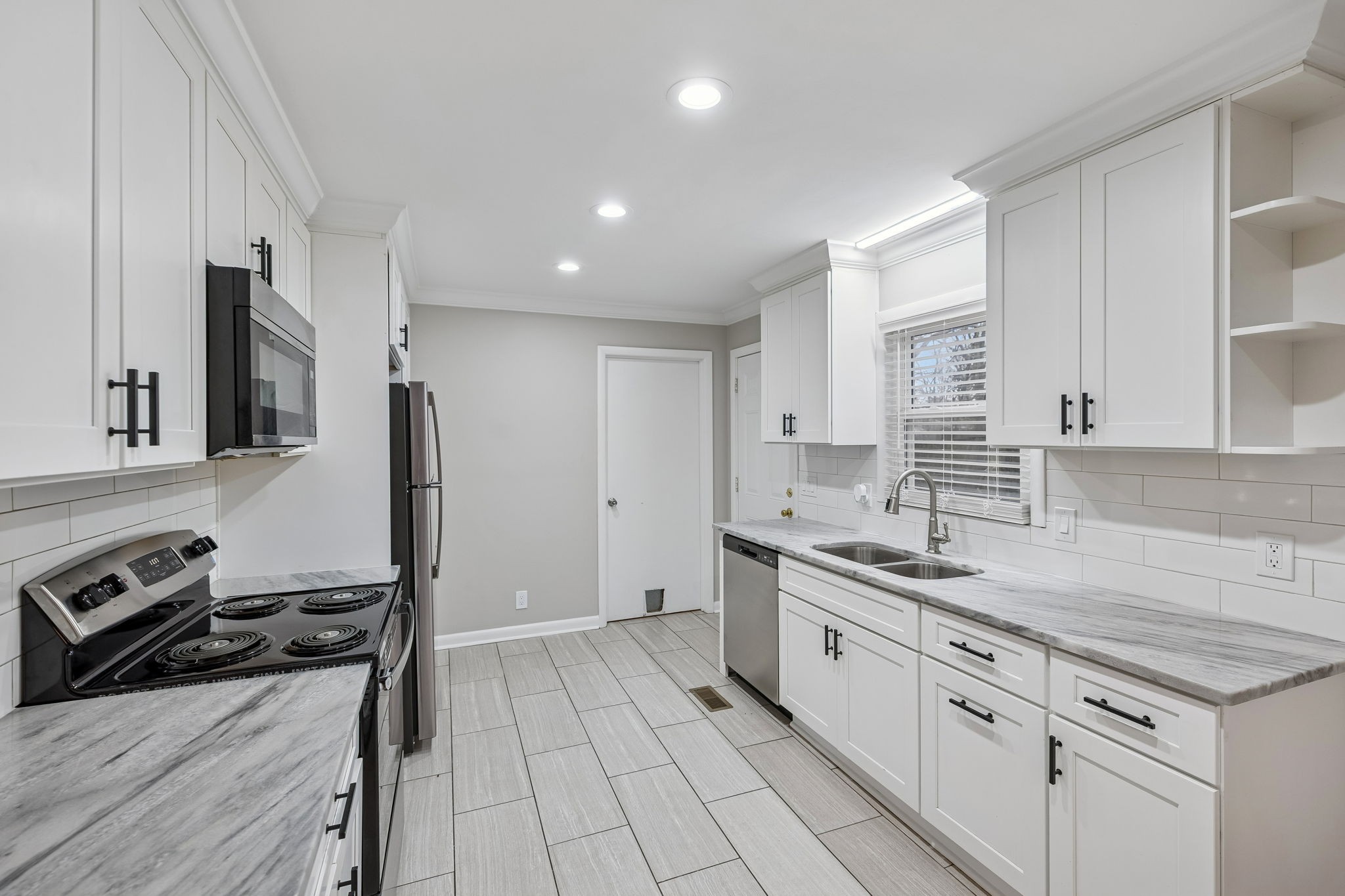 111 Chestnut Street Smyrna, TN 37167 - Photo 16 of 41 a kitchen with a sink stove and refrigerator