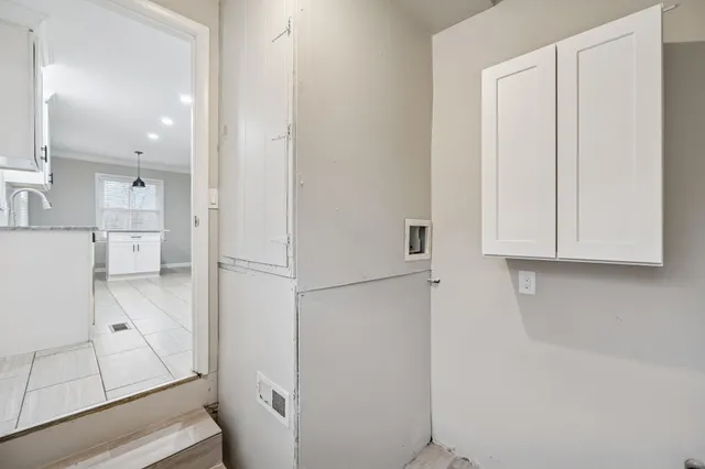 a view of cabinets and wooden floor