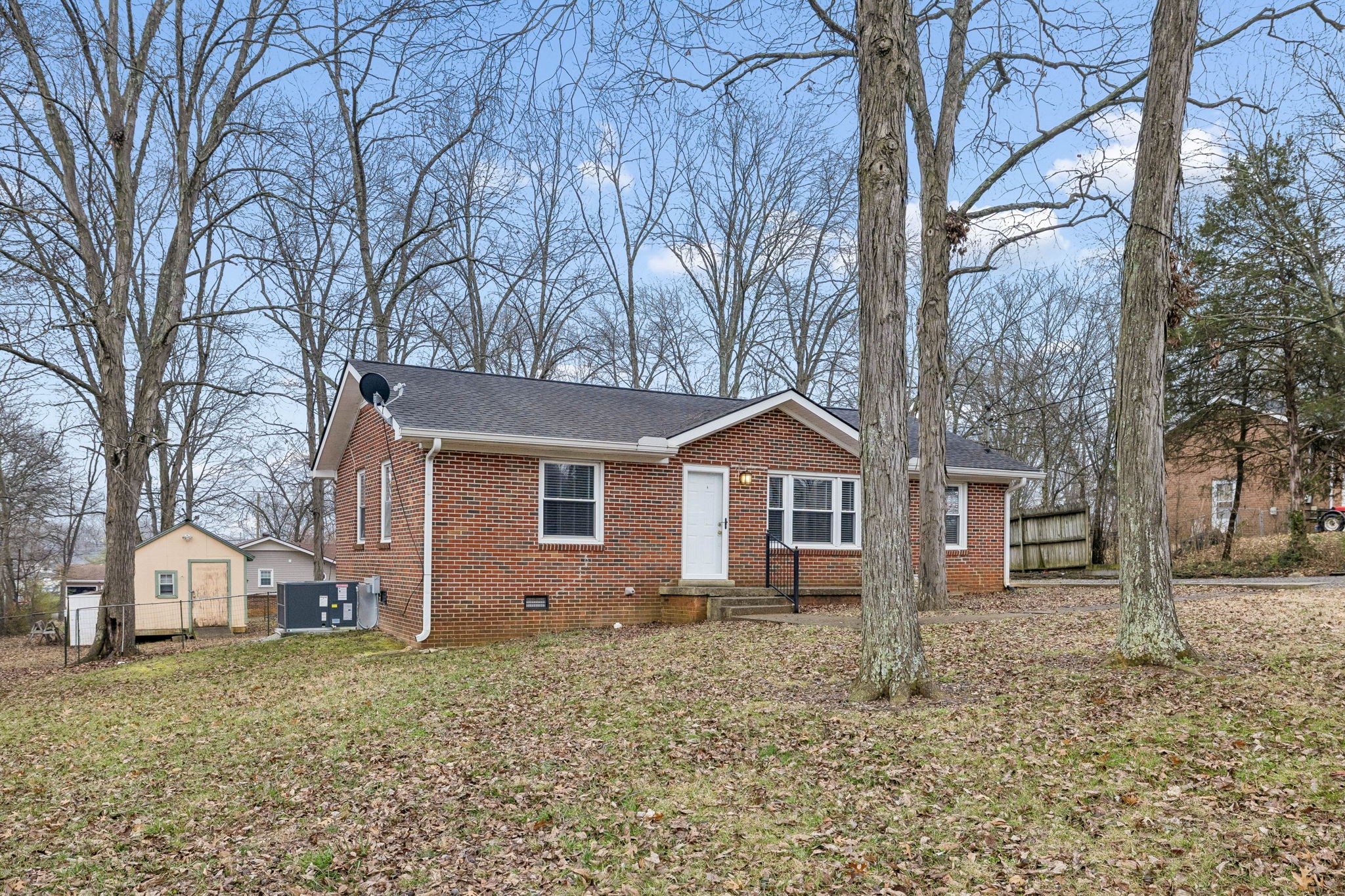 111 Chestnut Street Smyrna, TN 37167 - Photo 4 of 41 a front view of a house with a yard and large trees
