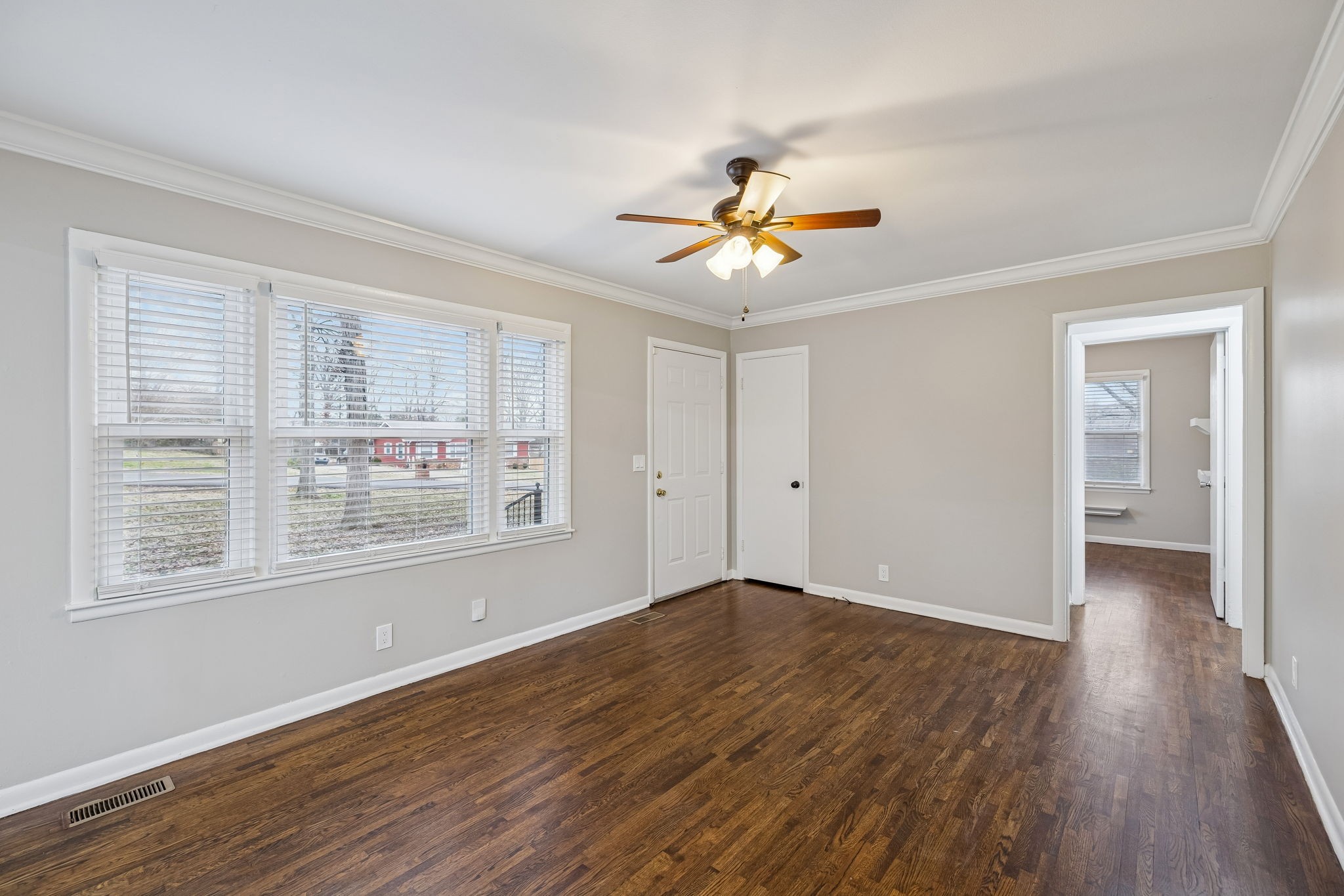 111 Chestnut Street Smyrna, TN 37167 - Photo 9 of 41 a view of an empty room with a window and wooden floor
