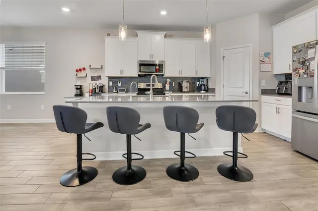 a kitchen with lots of counter space furniture and kitchen view