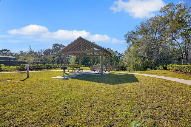 a view of swimming pool with an outdoor space and seating area