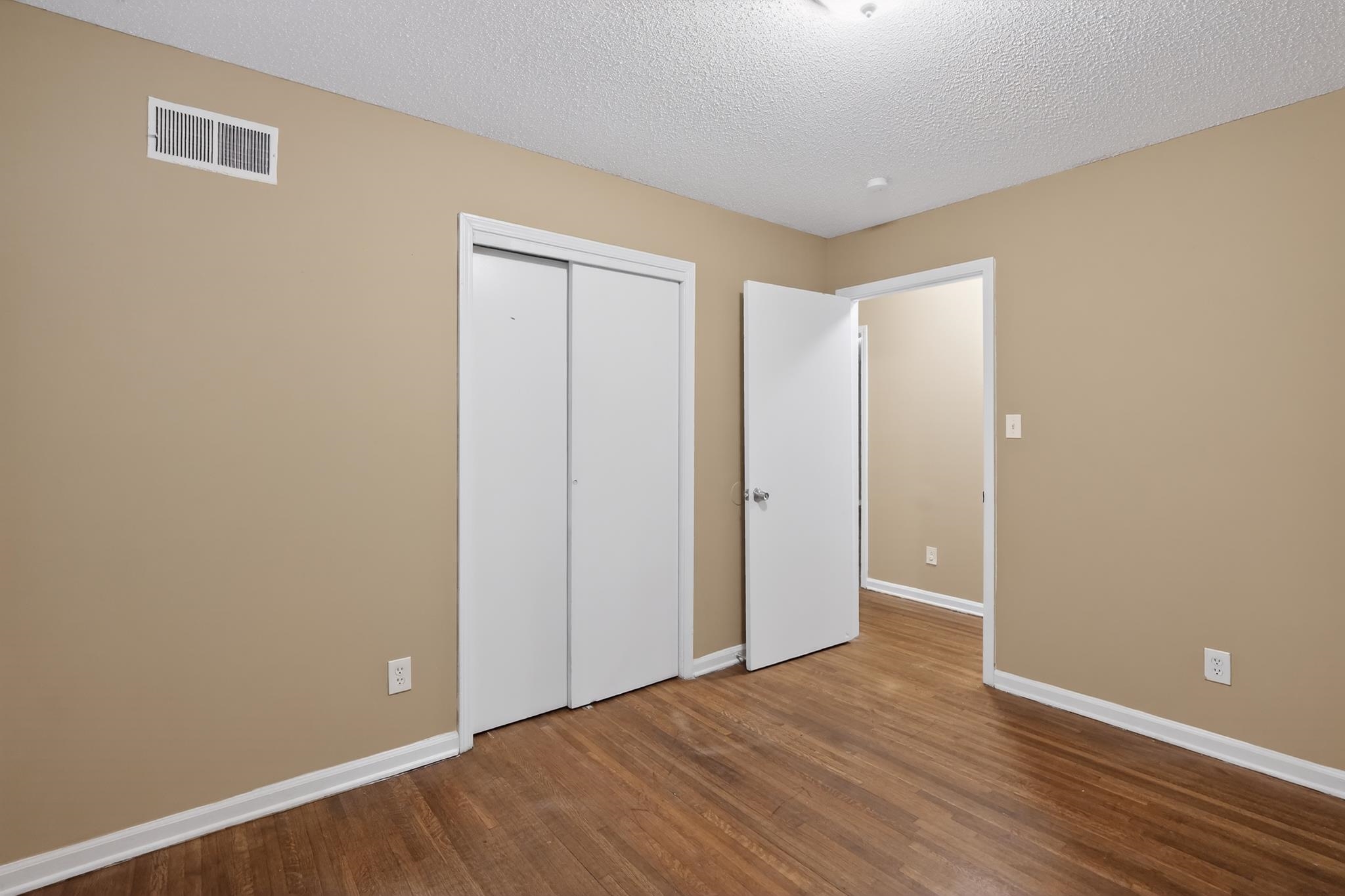 2015 East Holmes Road Memphis, TN 38116 - Photo 28 of 34 a view of an empty room with wooden floor