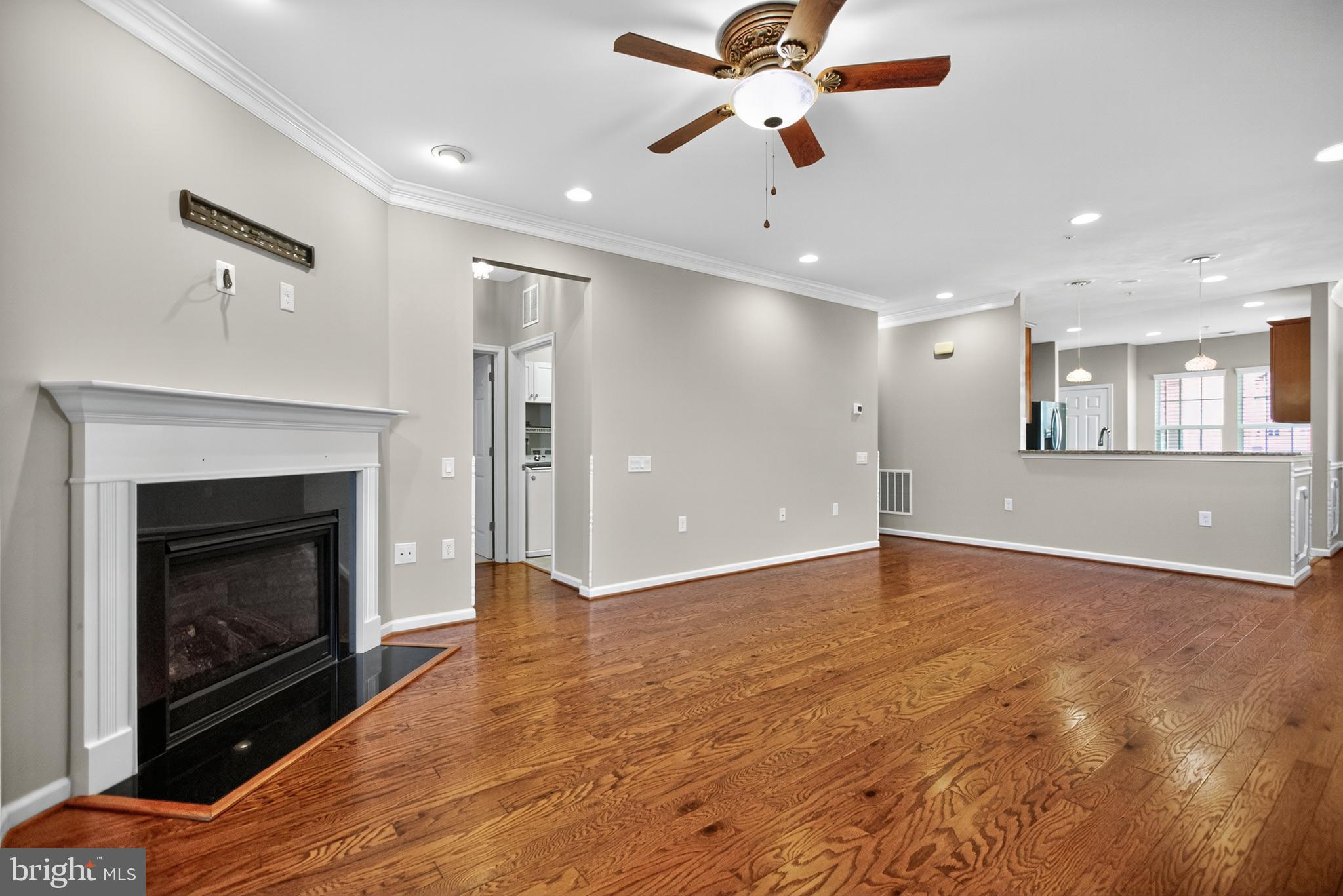32 Montauk Avenue Fredericksburg, VA 22406 - Photo 14 of 30 a view of an empty room with wooden floor and a fireplace
