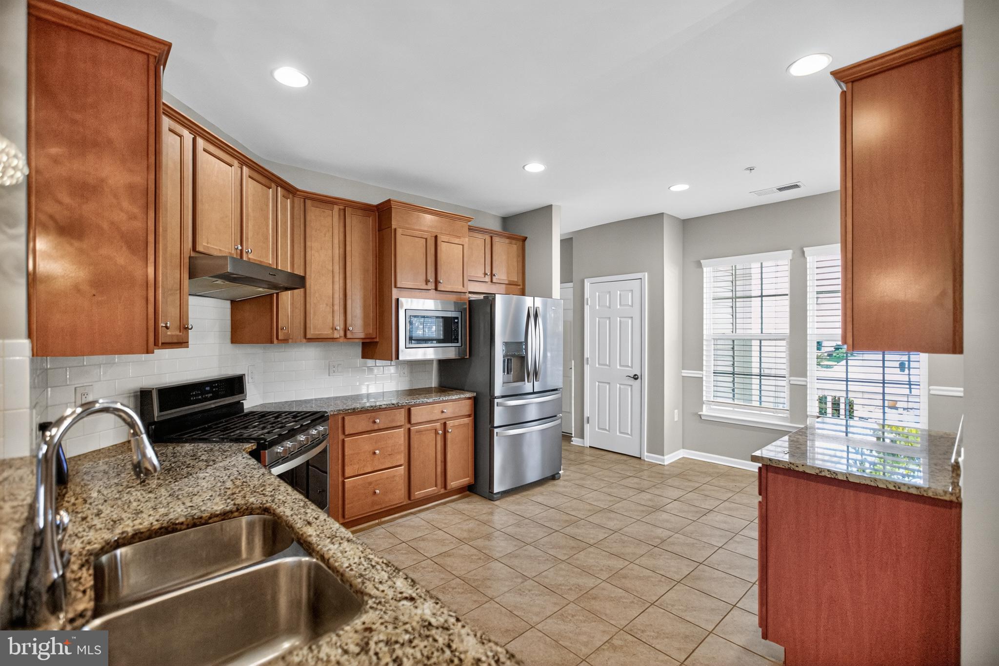 32 Montauk Avenue Fredericksburg, VA 22406 - Photo 16 of 30 a kitchen with stainless steel appliances granite countertop a sink stove and refrigerator