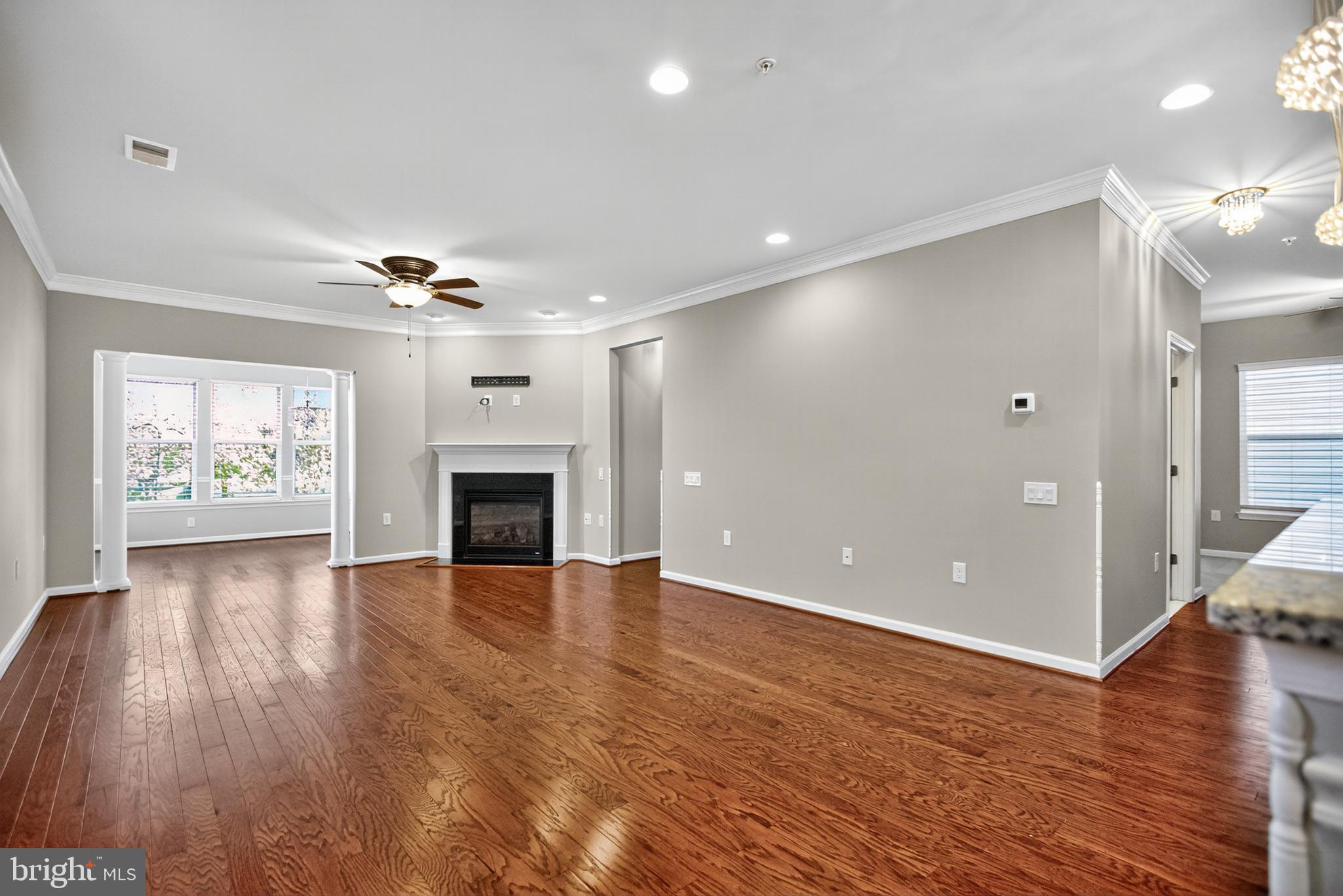 32 Montauk Avenue Fredericksburg, VA 22406 - Photo 3 of 30 a view of an empty room with wooden floor and a fireplace
