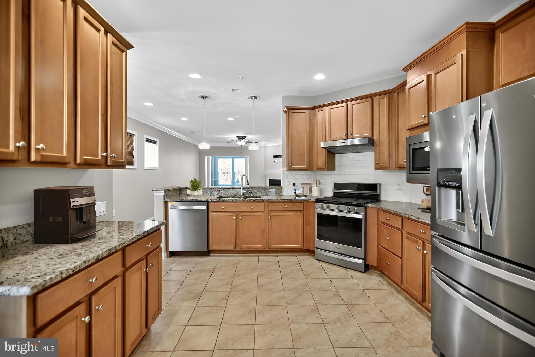32 Montauk Avenue Fredericksburg, VA 22406 - Photo 4 of 30 a large kitchen with stainless steel appliances granite countertop a stove a sink dishwasher a refrigerator and cabinets with wooden floor
