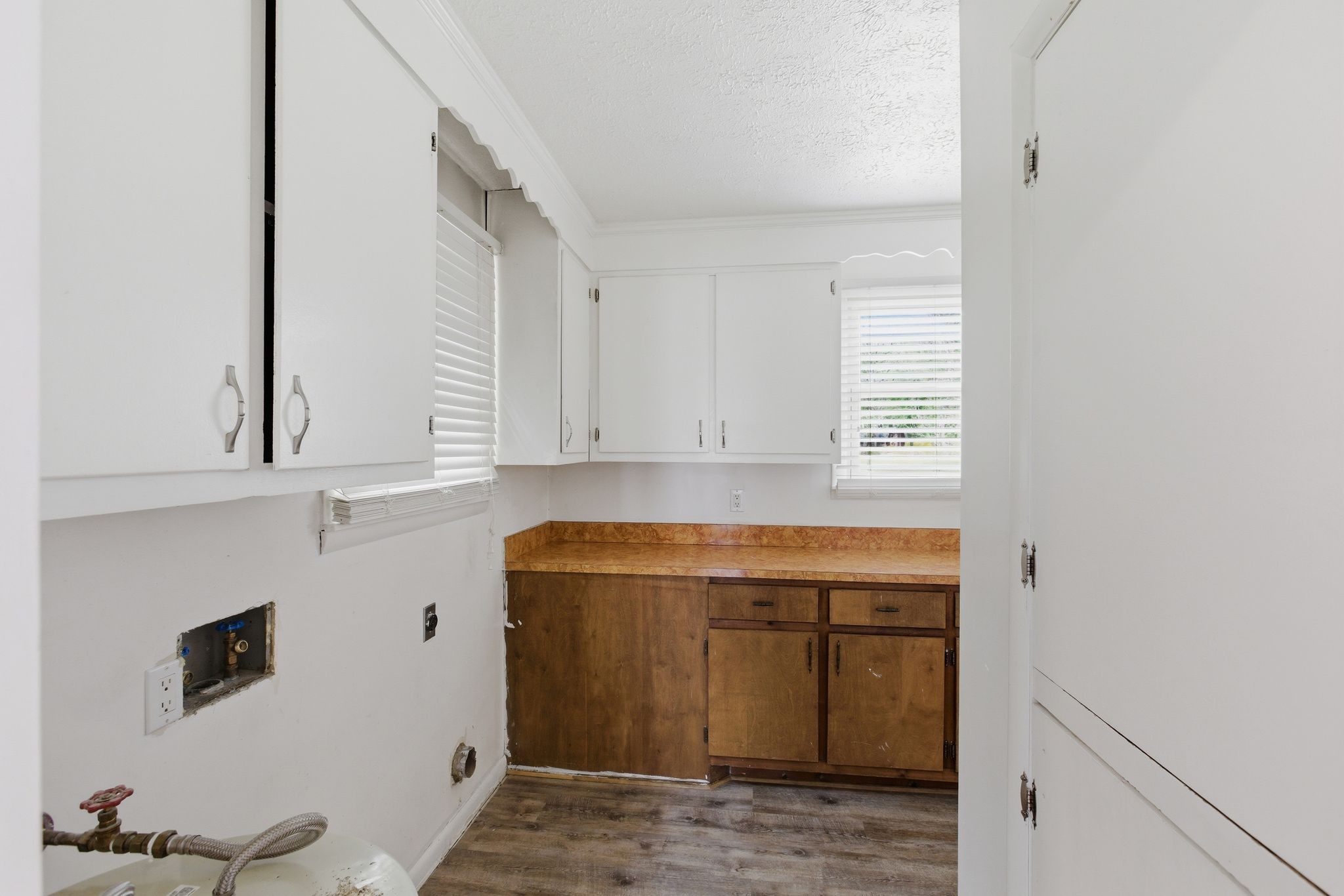 580 Defeated Creek Road Centerville, TN 37033 - Photo 29 of 71 a view of storage and utility room with washer and dryer