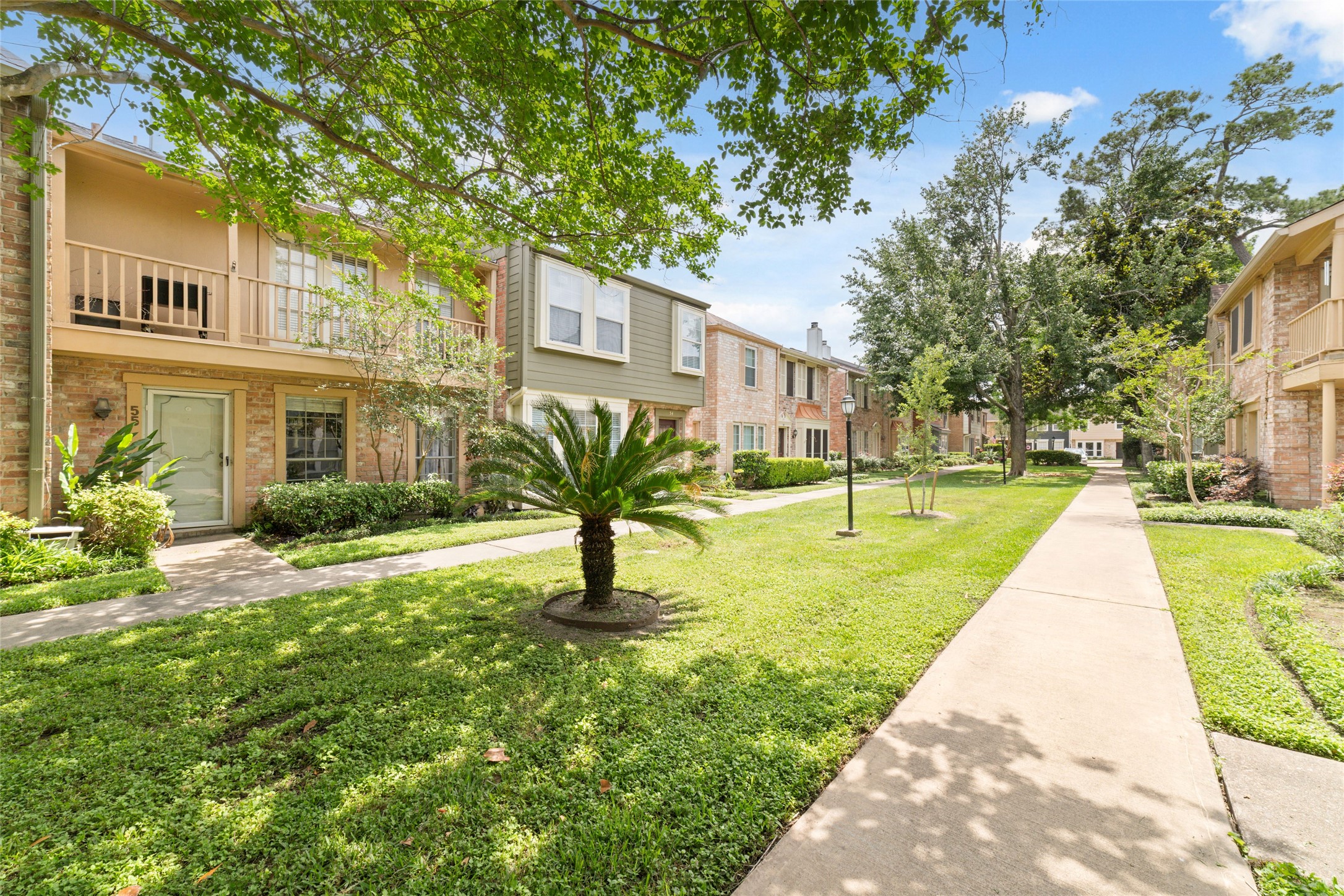 5800 Lumberdale Road, Unit 55 Houston, TX 77092 - Photo 2 of 34 a view of a house with a backyard