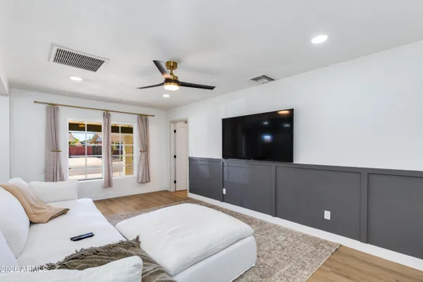 a bathroom with a toilet a sink and a mirror