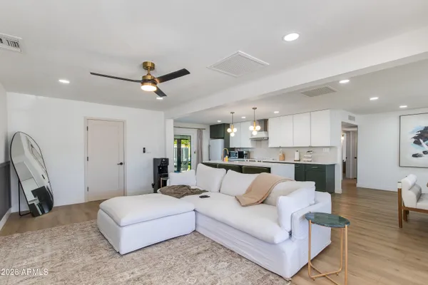 a bathroom with a sink toilet a shower and a mirror