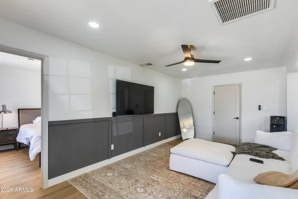 a bedroom with a bed and a desk