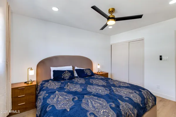 a view of a swimming pool with a deck and a patio