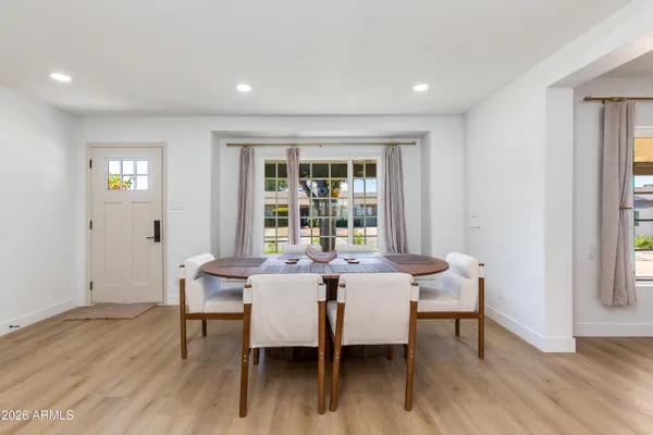 a view of a dining room with furniture and wooden floor