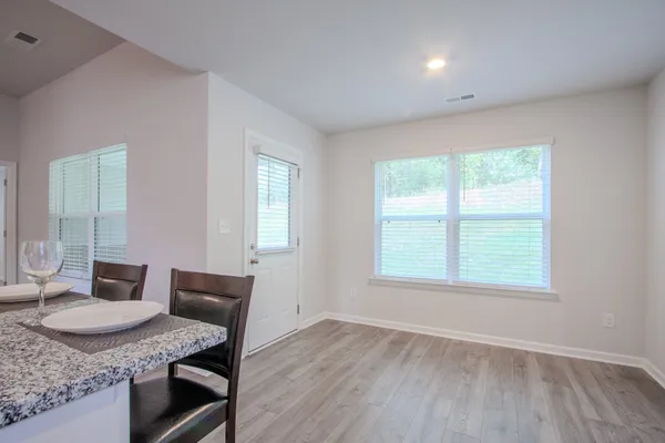 a kitchen with a table and chairs in it