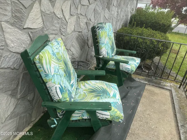 a view of outdoor sitting area with furniture
