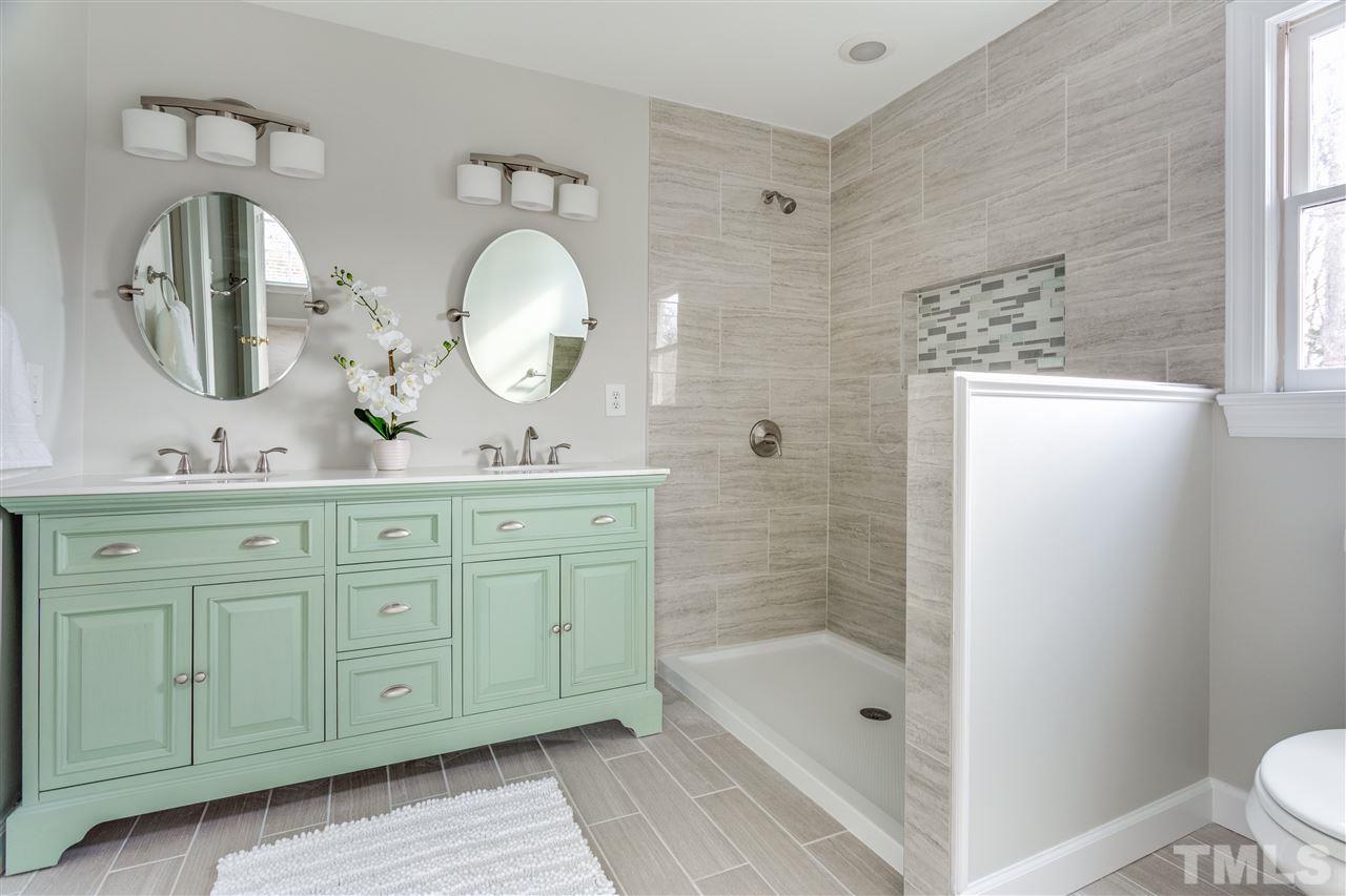 8416 Old Deer Trail Raleigh, NC 27615 - Photo 17 of 24 **Shower glass being installed 2/8