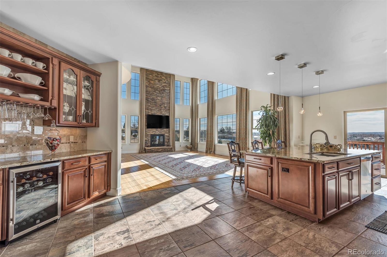 16520 East Easter Way Foxfield, CO 80016 - Photo 11 of 38 a open kitchen with stainless steel appliances granite countertop a stove and cabinets
