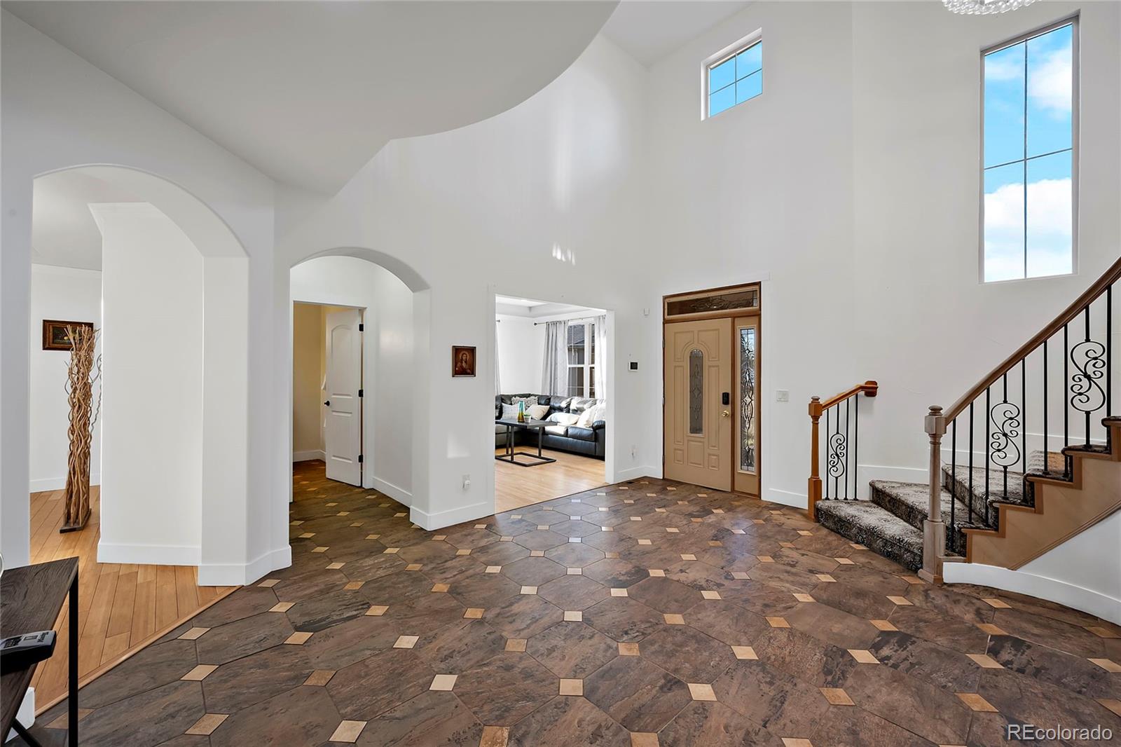 16520 East Easter Way Foxfield, CO 80016 - Photo 14 of 38 a view of a livingroom with wooden floor and stairs