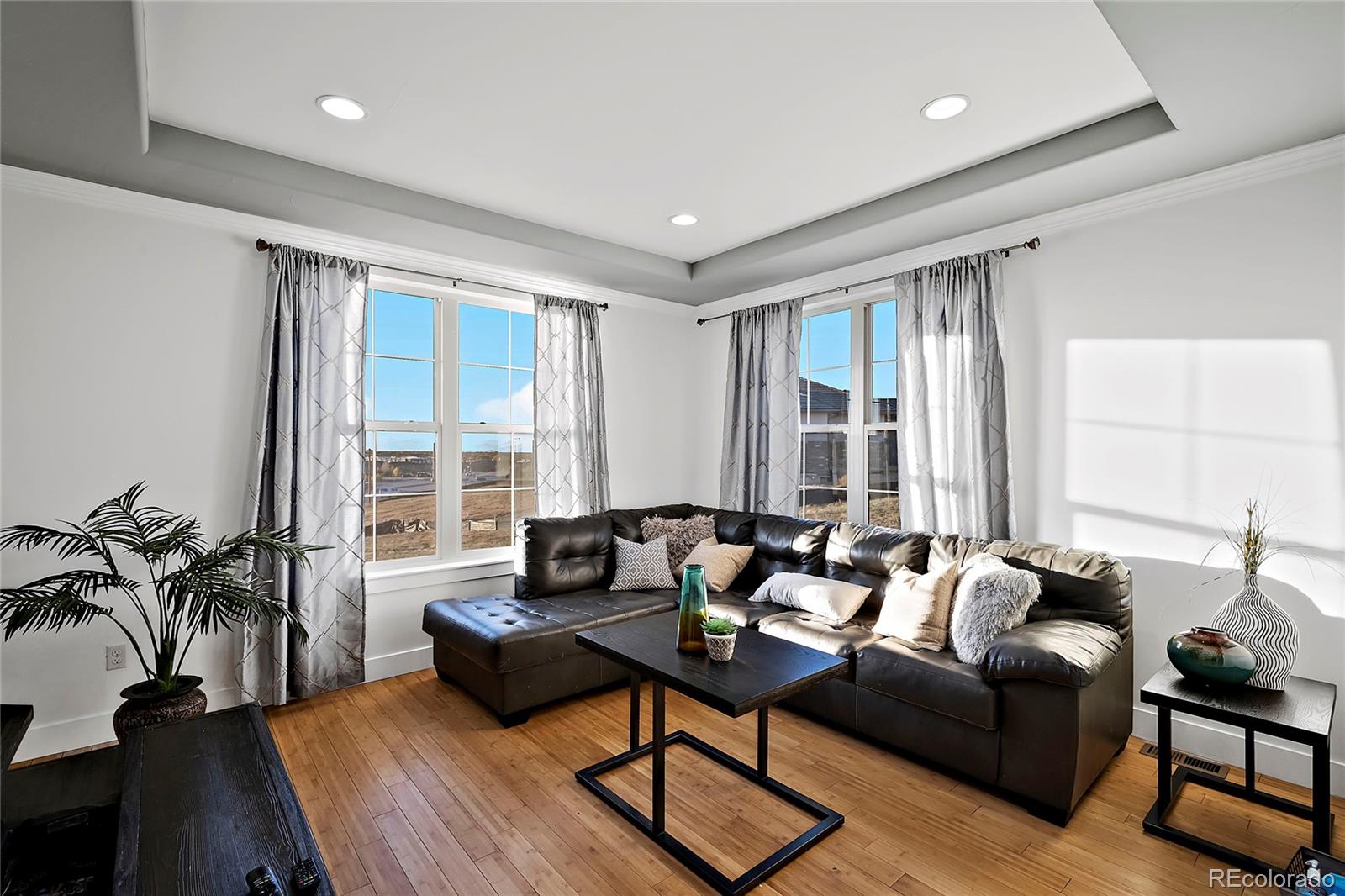 16520 East Easter Way Foxfield, CO 80016 - Photo 15 of 38 a living room with furniture and floor to ceiling windows